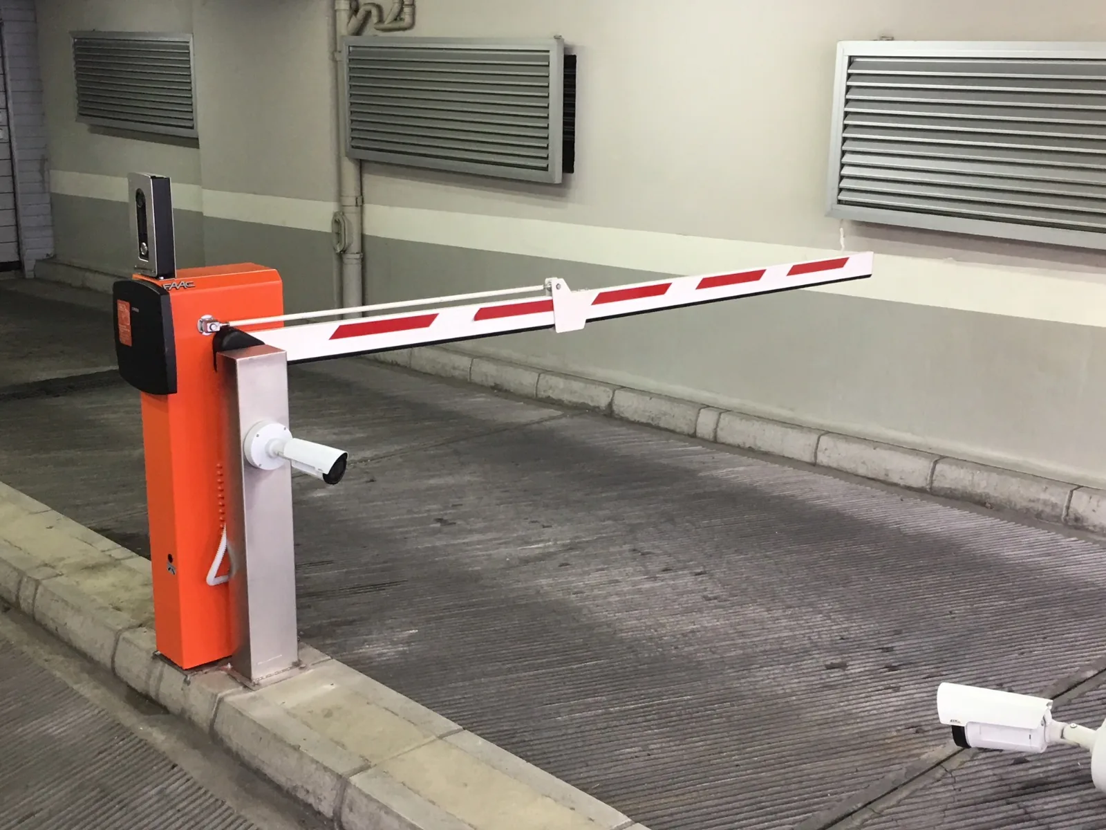 Garage barrier with a camera on the post