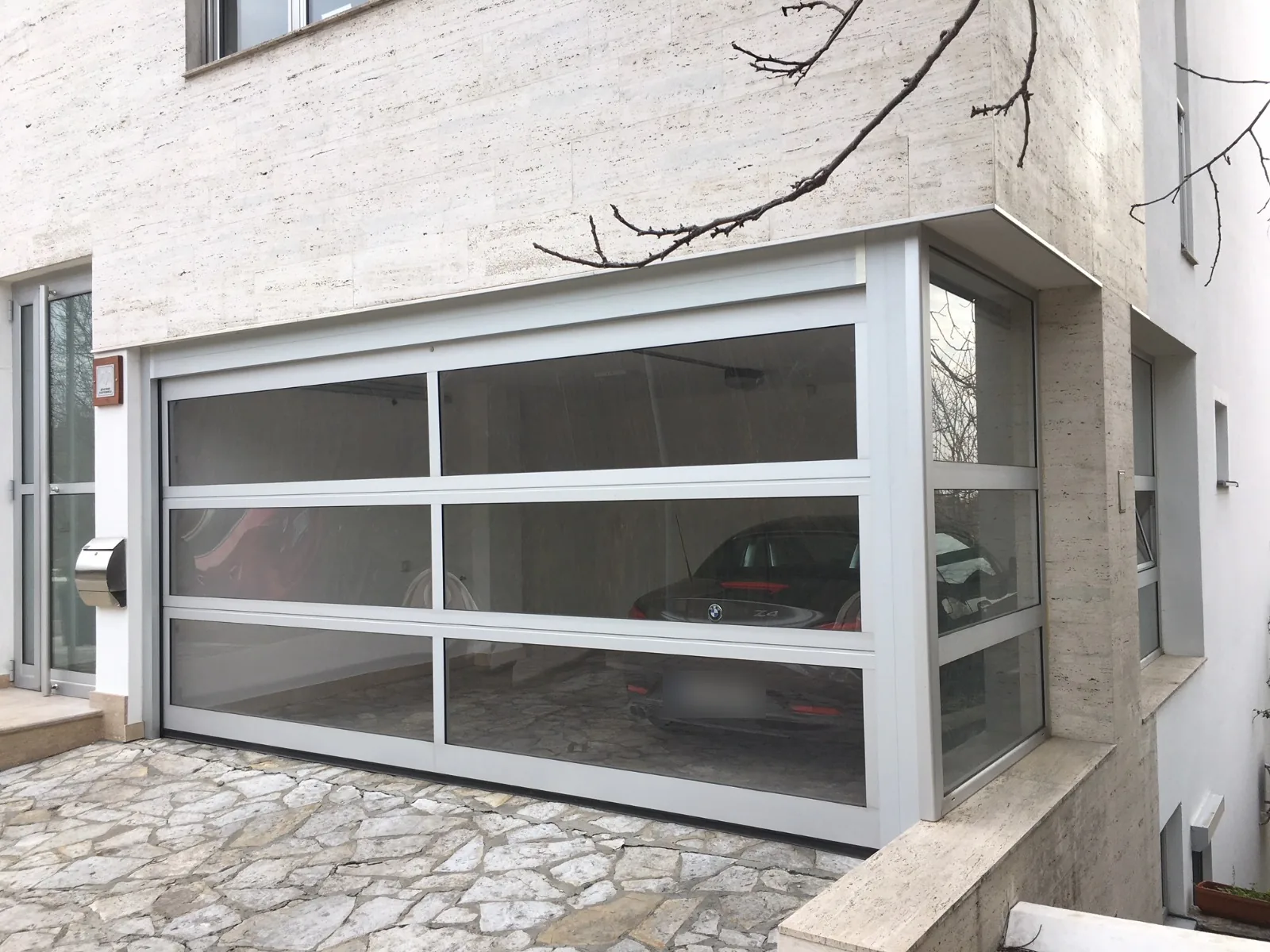 Glazed garage door with an aluminium frame