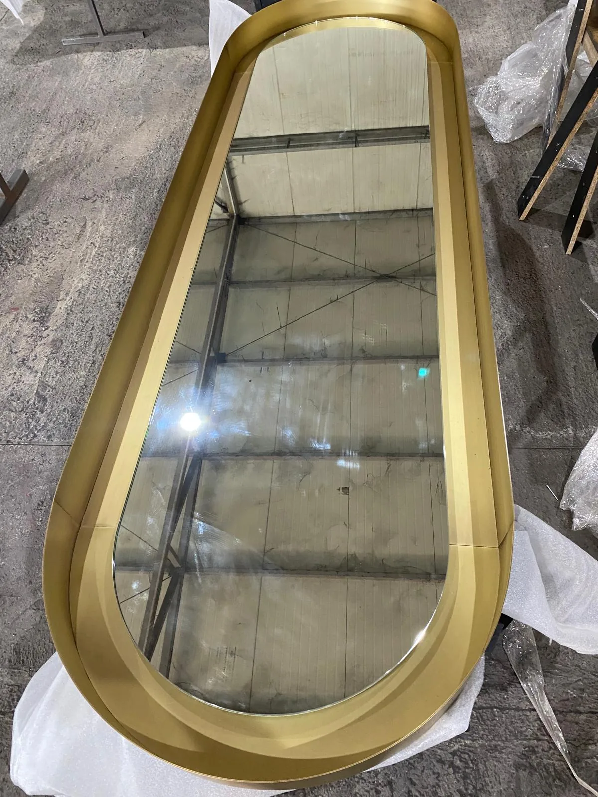 Mirror in a brass-coloured frame