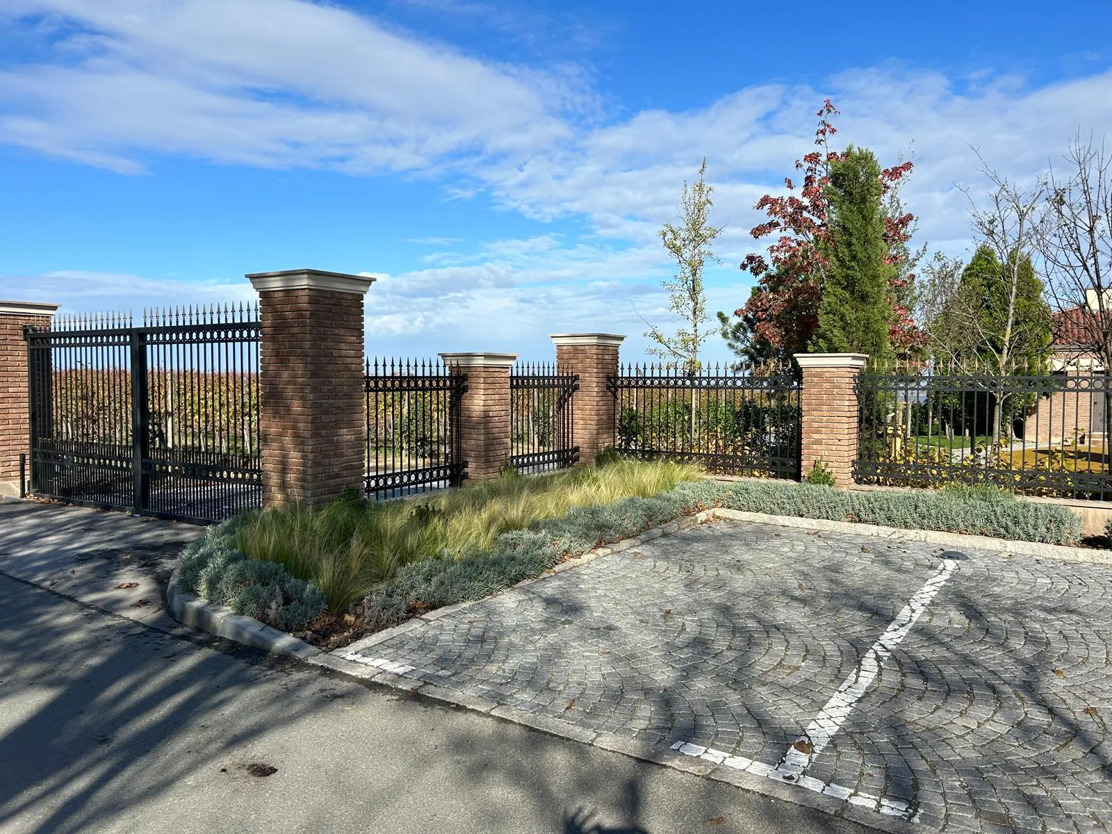 Fence and gate between brick posts