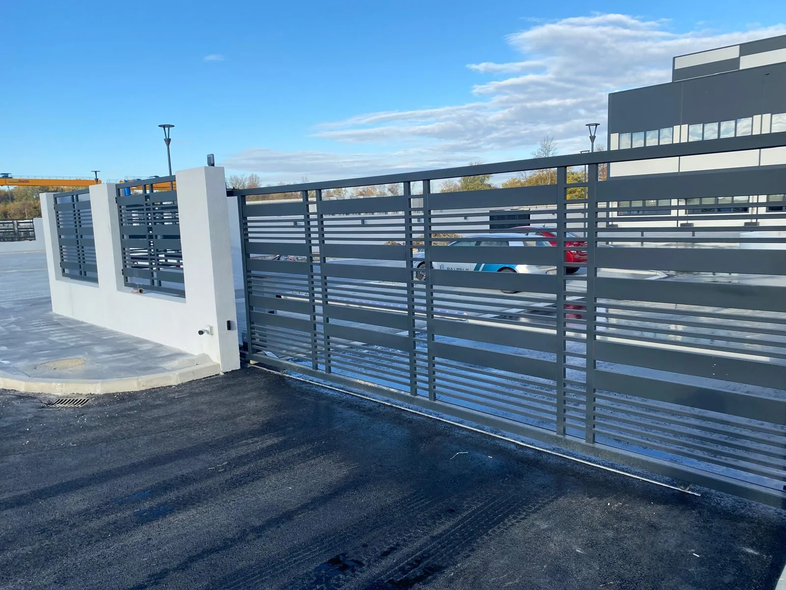 Sliding gate in a site fence