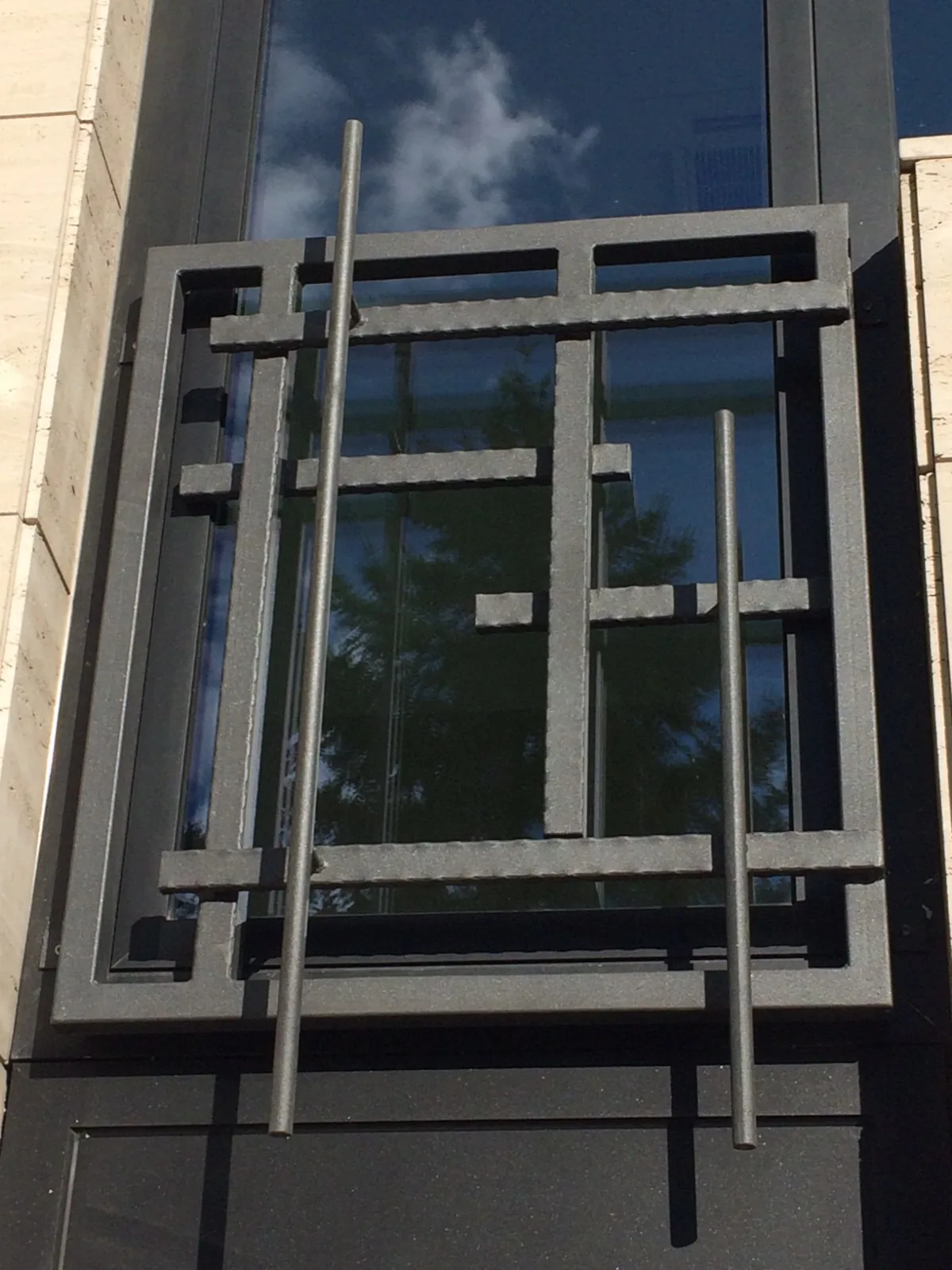 Decorative window grille with a geometric arrangement of bars